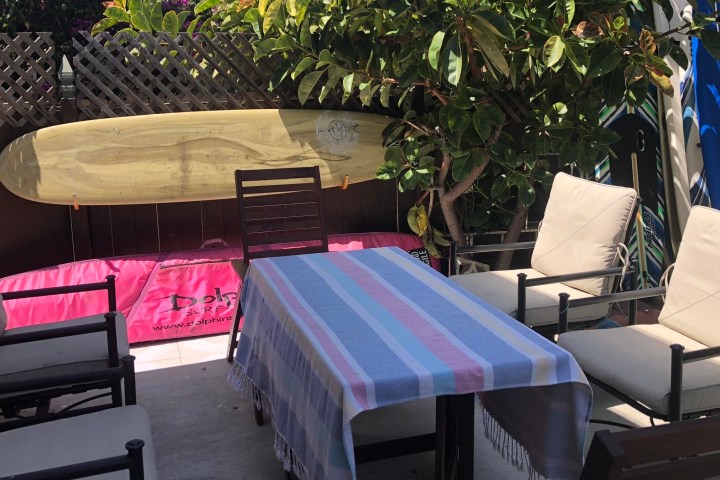 a bedroom with a bed and a chair in a room