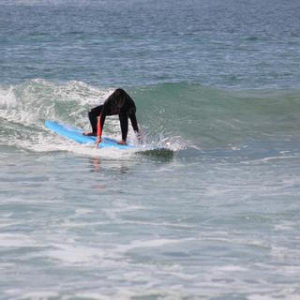 a person riding a wave on a surfboard in the water